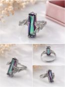Title: Multicolour Faceted Stone Ring – Size 18 Description: Elegant silver-tone ring set with a