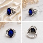 Title: Deep Blue Oval Stone Silver-Tone Statement Ring Description: Bold silver-tone ring
