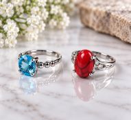 Title: Set of Two Silver-Tone Rings with Blue & Red Stones Description: A stylish set of two