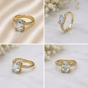 Title: Natural Blue Topaz Oval Cut Gold Tone Ring Description: Elegant gold-tone ring featuring a
