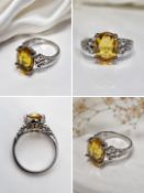 Title: Yellow Gemstone Silver Ring with Ornate Filigree Design Description: Elegant silver-tone ring