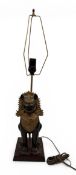 AN EARLY 20TH CENTURY BRONZE LAMP IN THE FORM OF A THAI TEMPLE LION