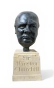 TRISTRAM LEWIS (BRITISH): A BRONZE BUST OF SIR WINSTON CHURCHILL ON FINELY CARVED BLENHEIM STONE BAS