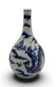A CHINESE 19TH CENTURY BLUE AND WHITE BOTTLE VASE, DECORATED WITH A DRAGON AND PHOENIX