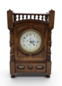 AN ARTS AND CRAFTS MANTEL CLOCK WITH BLUE AND WHITE DIAL IN THE MANNER OF LEWIS F. DAY