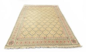 A FRENCH CARPET WITH IVORY FIELDS