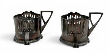 WMF: TWO JUGENDSTIL PEWTER TEA CUP HOLDERS, CIRCA 1900