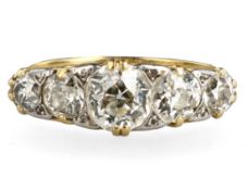 AN ANTIQUE 18 CARAT GOLD FIVE STONE NATURAL DIAMOND RING