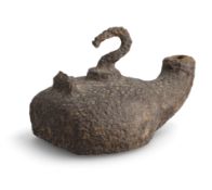 AN ANTIQUE IRON OIL LAMP