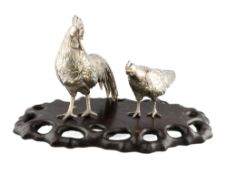 A PAIR OF SILVERED METAL OKIMONO MEIJI PERIOD BIRDS
