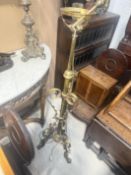 AN ARTS AND CRAFTS BRASS FLOOR LAMP