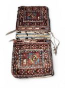 AN ANTIQUE SADDLEBACK TRIBAL RUG