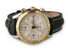 AN OMEGA STEEL AND GOLD SPEEDMASTER AUTOMATIC TRIP CALENDAR CHRONOGRAPH WATCH