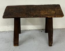 18th Century oak stool on four splayed legs. H 52cm x D23cm x W65cm