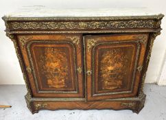 A Napoleon Marquetry sideboard with a marble top, floral inlay and ornate gilt brass mounts (