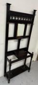 An Arts and Crafts style hall stand with pierced cut outs and original drip trays. H 200cm x D