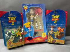 Three Tot Story II boxed figures to include Buzz and Woody