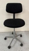 A Mid Century adjustable office chair on a chrome base and upholstered in black Condition Report