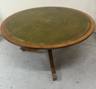 A regency style mahogany and leather top coffee table (118cm x 53cm)