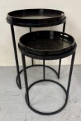 A set of two contemporary black lacquer and gold circular nesting tables H69cm Dia48cm