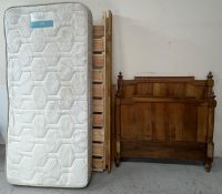 A French-style single bedframe, arched panel H110cm W117cm Condition Report mattress is marked,