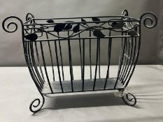 Metal magazine rack on scrolling feet (H38cm W52cm)