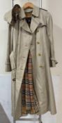 A Ladies Burberry trench coat and matching hat (Size 10)