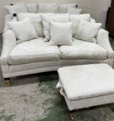 Two Durest two-seater dropped-sided sofas, along with a matching footstool