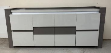 High gloss sideboard white and grey panelled doors opening to shelves, fitted with interior lights