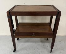 A Mid Century metamorphic two tier tea trolley