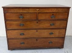 A Georgian style two over three chest of drawers with a central shell form inlaiad shield. Height