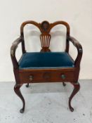 An Edwardian style piano stool with carved back and single drawer and cabriole legs