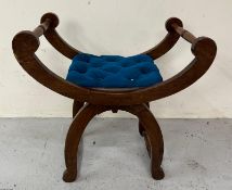 A Mahogany Empire style stool with turned handles and blue button tufted seat Condition Report A few