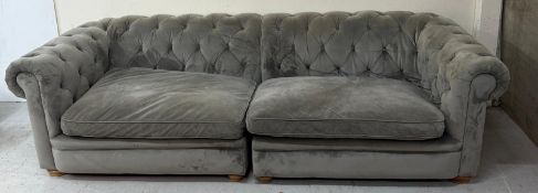 A grey velvet four seater sofa by Alexander James Condition Report multiple marks and stains