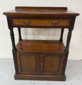 A mahogany buffet with galleried top and turned supports with a single drawer over a two door