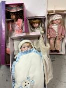 Four large porcelain dolls by The Leonardo Collection to include 
