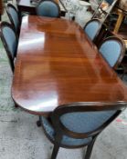Mahogany dining table and four chairs and two carvers upholstered in blue H77c W200c D93cm