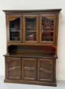 A oak dresser comprising of three glazed doors to top with three cupboard doors under H198cm