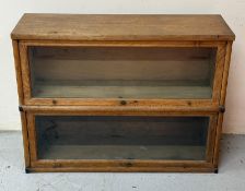 A two tier globe Wernicke glazed sectional bookcase H65cm W87cm D29cm Condition Report some stains