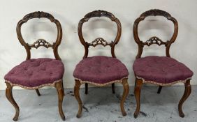 Three walnut balloon back chairs with carved backs on cabriole legs Condition Report Some age