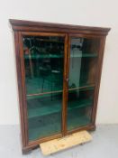 A Mahogany display cabinet with two glazed glass panelled doors 130cm wide x 32cm deep x 170cm