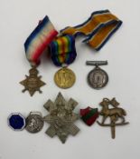 A trio of WWI medals. PTE L.E. Francis of the Queens regiment. Together with a selection of badges.