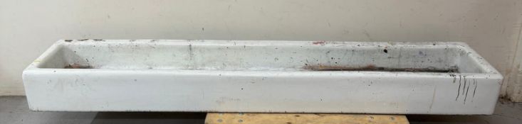 A white Belfast sink previously used as an artist's wash station 190cm x 40cm x 20cm Condition