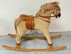 A kids rocking horse with saddle and bridle Condition Report light marks to top