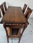 A Jacobean style oak dining table with 5 leather upholstered chairs (H78cm x 73cm x 153cm)
