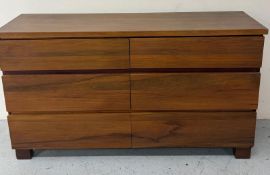 A contemporary rimu wood chest of drawers consisting of six short drawers on square legs 145cm x