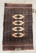 A wool prayer mat with purple grounds and geometric border (104cm x 65cm) Condition Report Some