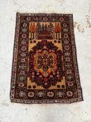 A wool rug with black grounds and geometric border (120cm x 80cm) Condition Report Good condition