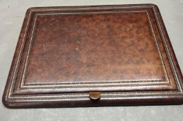A leather desk top writing pad
