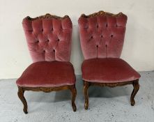 A pair of Louis style fireside/nursing chair upholstered in pink velvet of carved cabriole legs